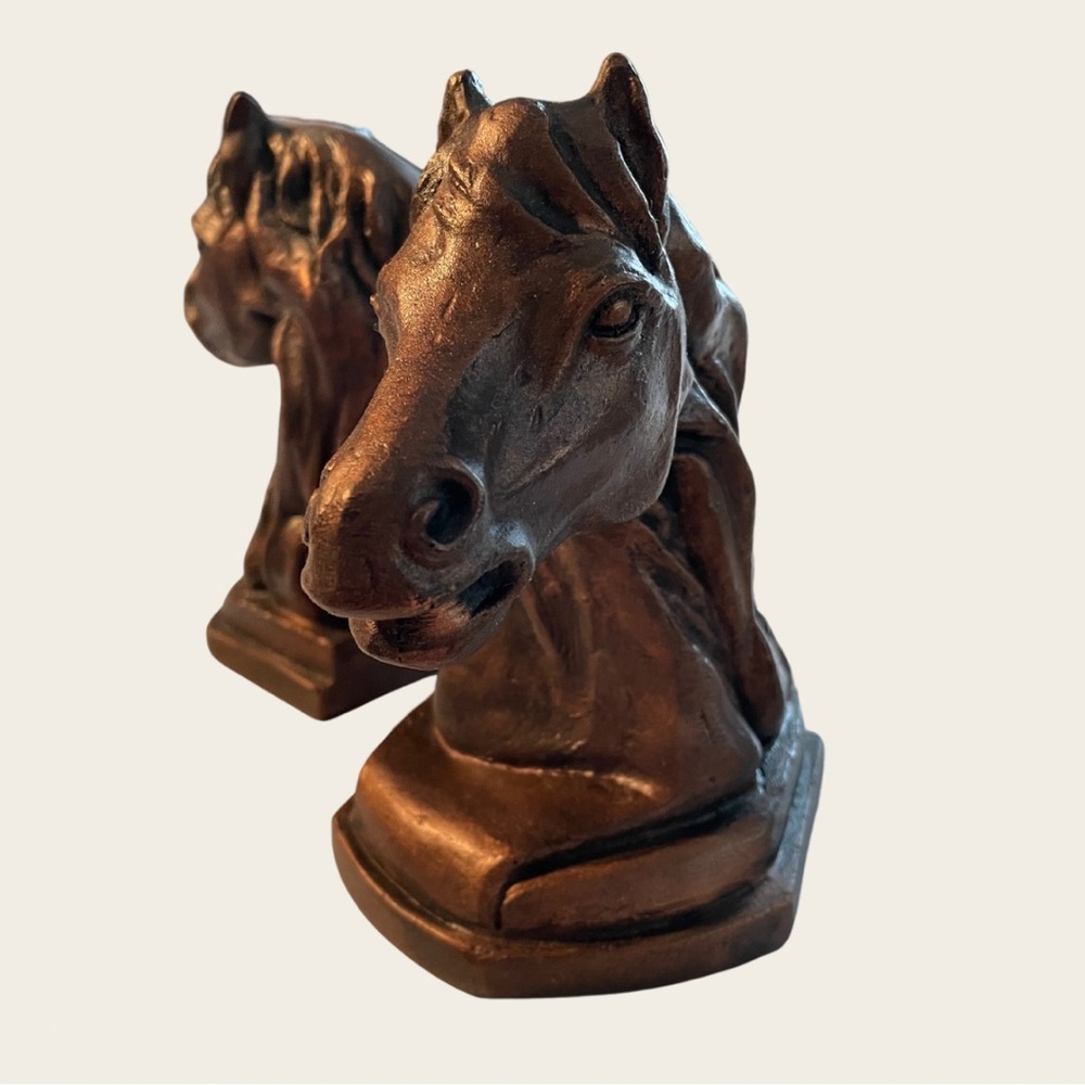 Two horse-bust bookends. Material appears to be plaster painted bronze.